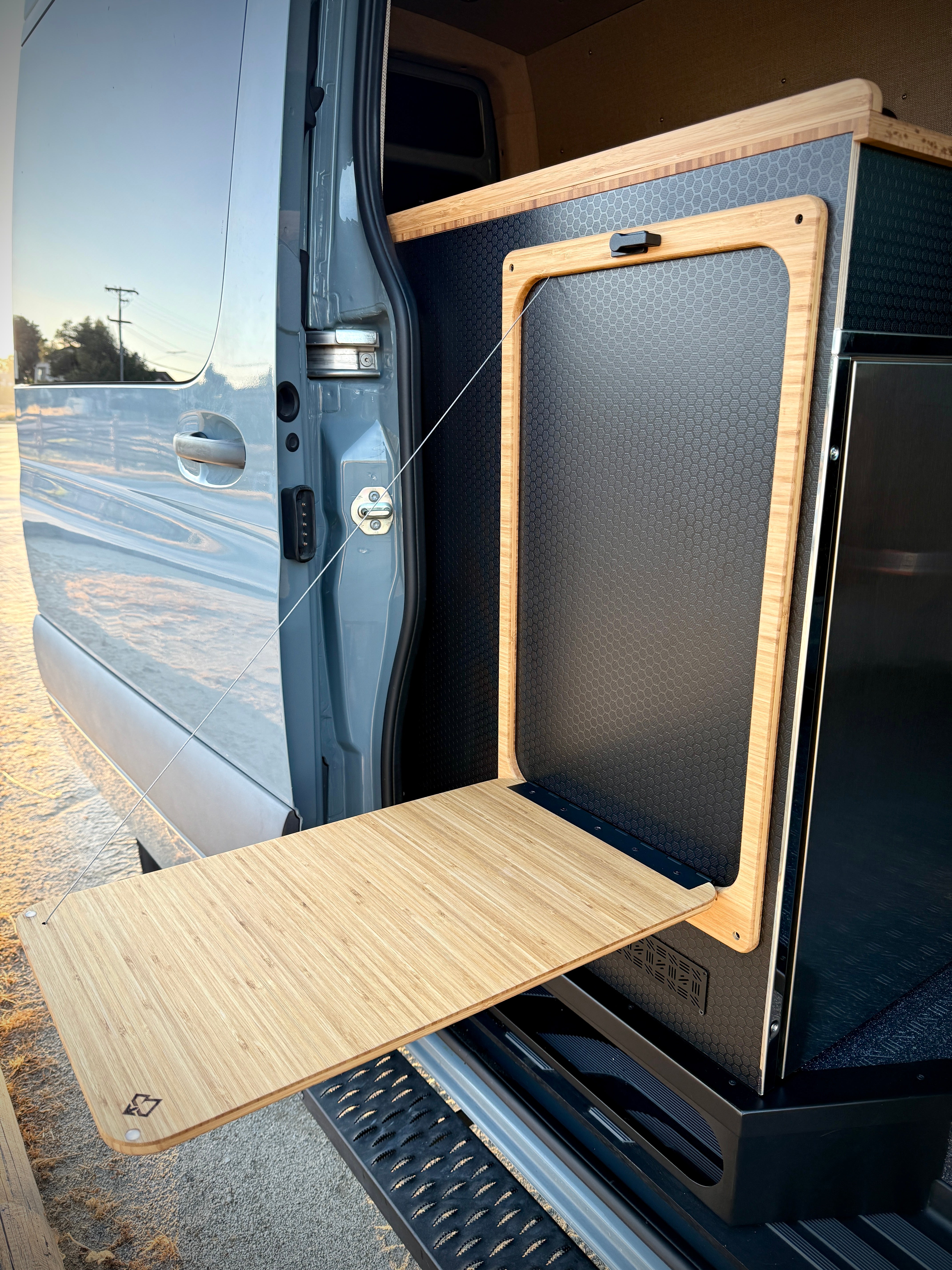 Bamboo folding table attached to a vehicle door