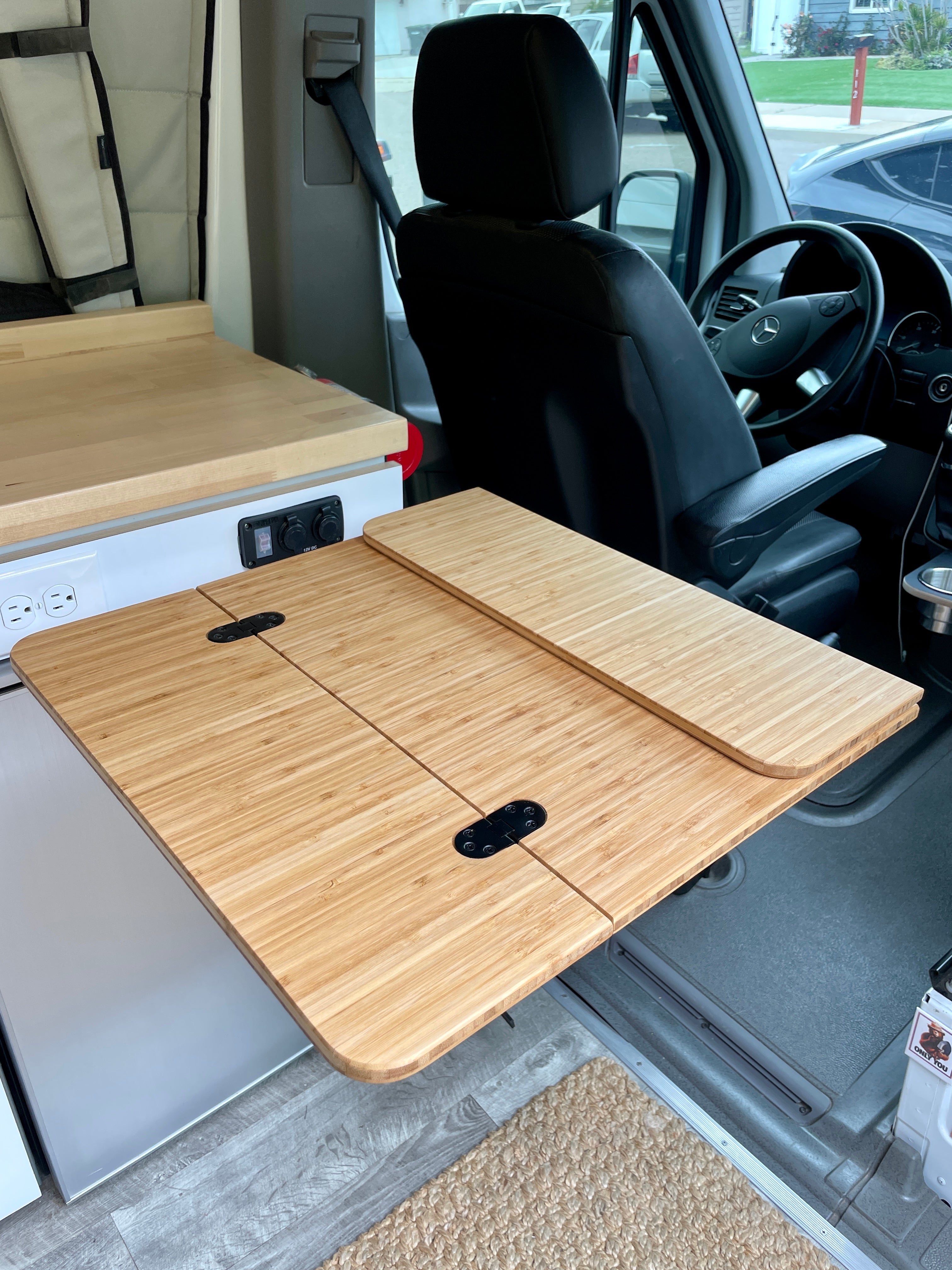 Folding Bamboo Table for Lagun Mounts, 1/2" Solid Plyboo© Bamboo. Size: 21 1/2"x14" folded, 21 1/2"x28" extended. No predrilled holes. Designed with beveled edge and rounded corners. Ready to mount with hinges preinstalled. Made in San Diego, CA. Ships free to valid street addresses in the lower 48 USA.