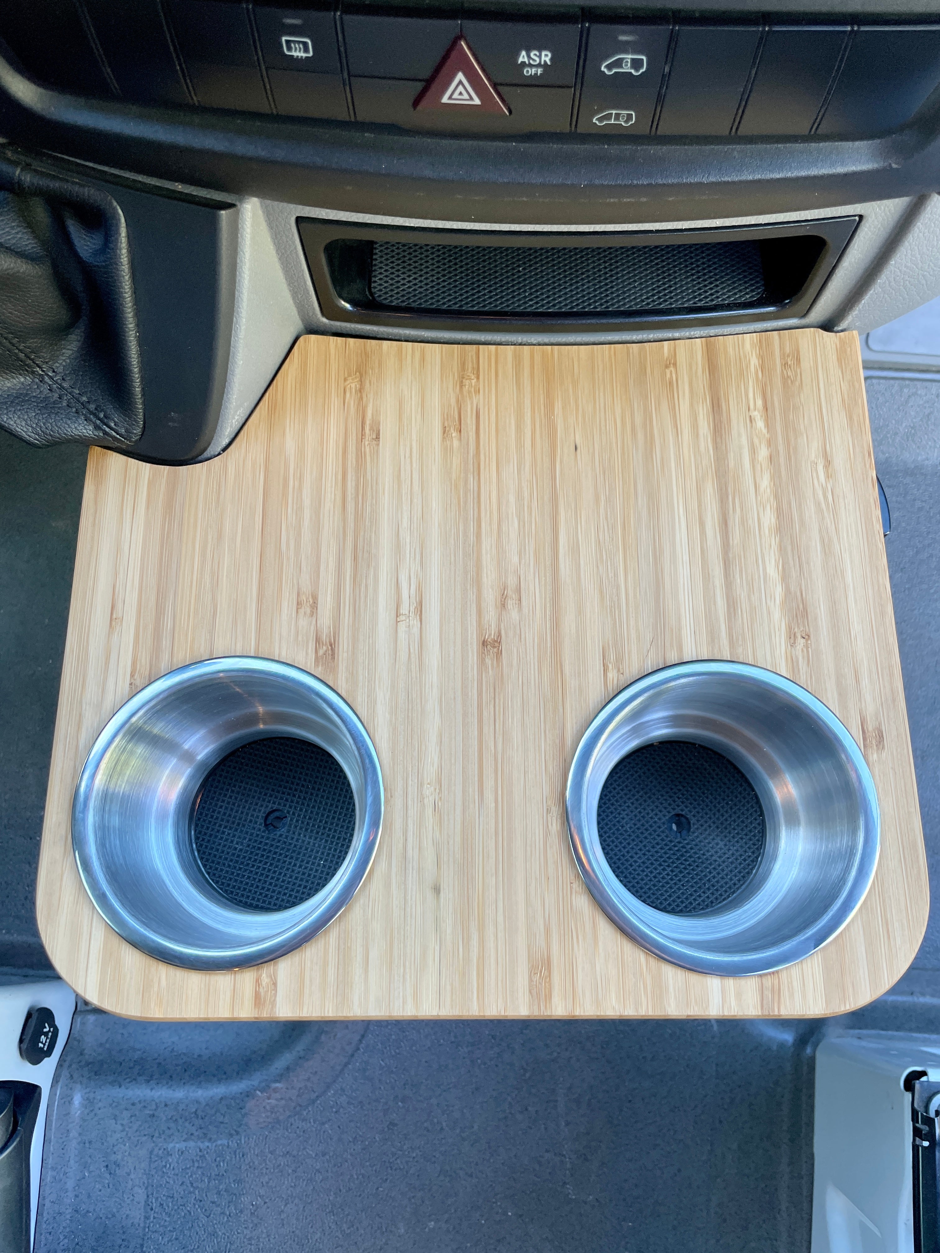 Sprinter NCV3 06-18 Cup Holder Snack Tray, XL Stainless Cup Holders, 12"x10.25". Bamboo Amber finish, 1/2" Solid Plyboo© Bamboo. Fits factory sliding cup holders, ideal for snacks and phone storage. Handcrafted in San Diego, CA. Free shipping in the lower 48 USA.