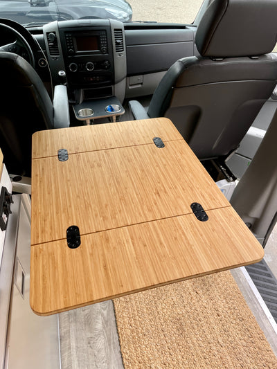 Camper Van/RV Folding Bamboo Table, 1/2" Solid Plyboo© Bamboo. Dimensions: 21 1/2"x14" folded, 21 1/2"x28" extended. Beveled edge, rounded corners, finished with Rubio Monocoat Natural Oil. Preinstalled with four mortised flush mount hinges. Handcrafted in San Diego, CA. Free UPS Ground shipping in the lower 48 USA.